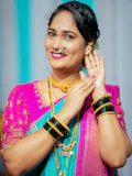 A woman in traditional indian attire smiles