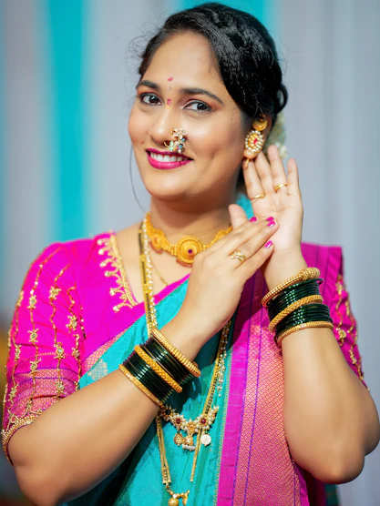 A woman in traditional indian attire smiles