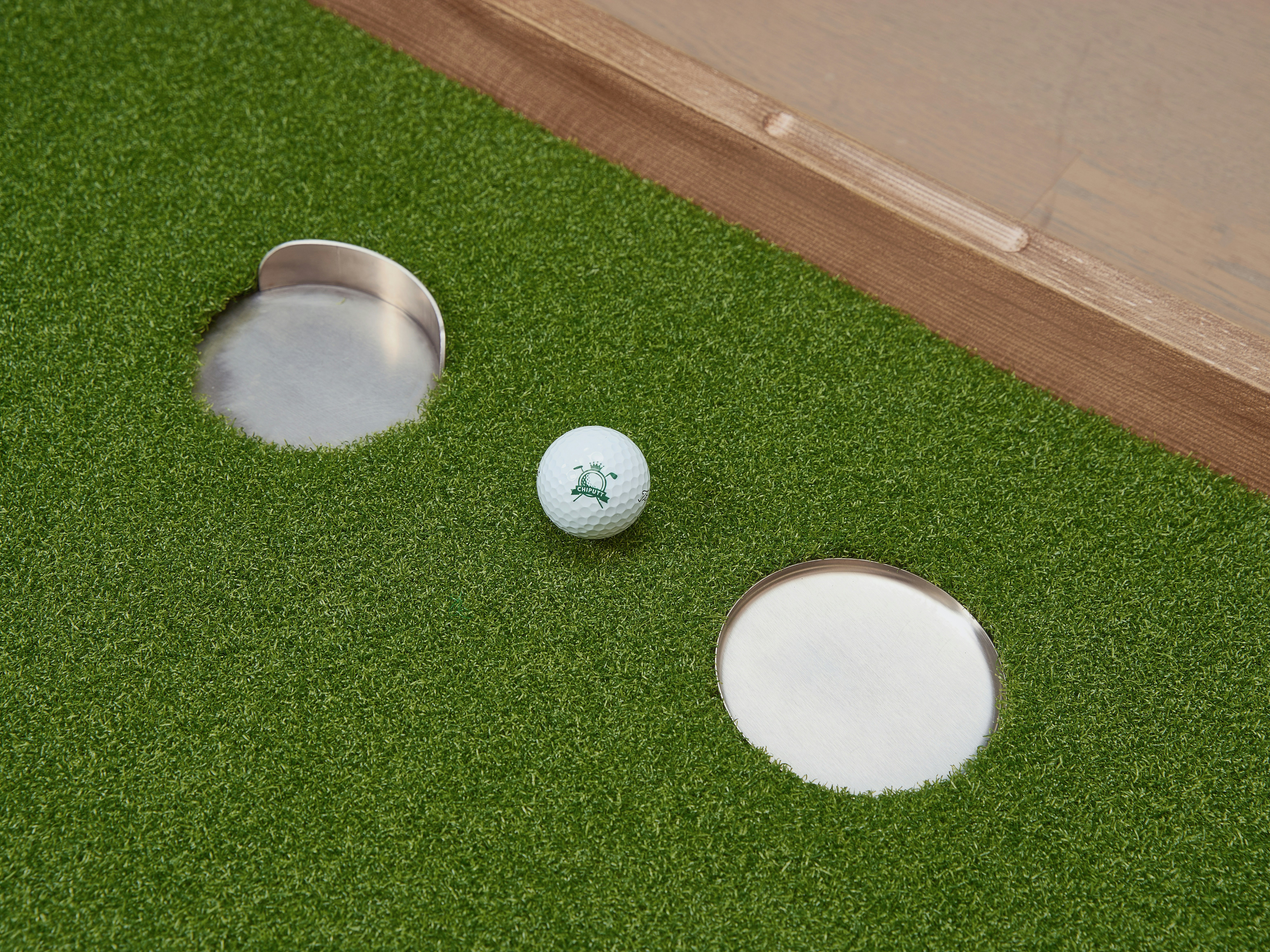 Golf balls on an indoor putting turf