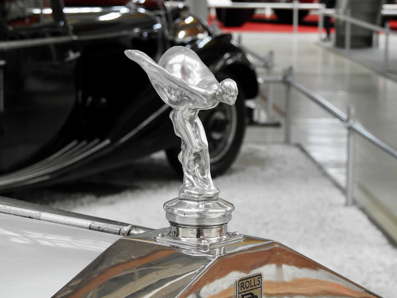 Silver hood ornament on a vintage car