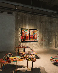 Colorful abstract art displayed in a gallery setting.