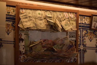 Framed display of various currencies and banknotes