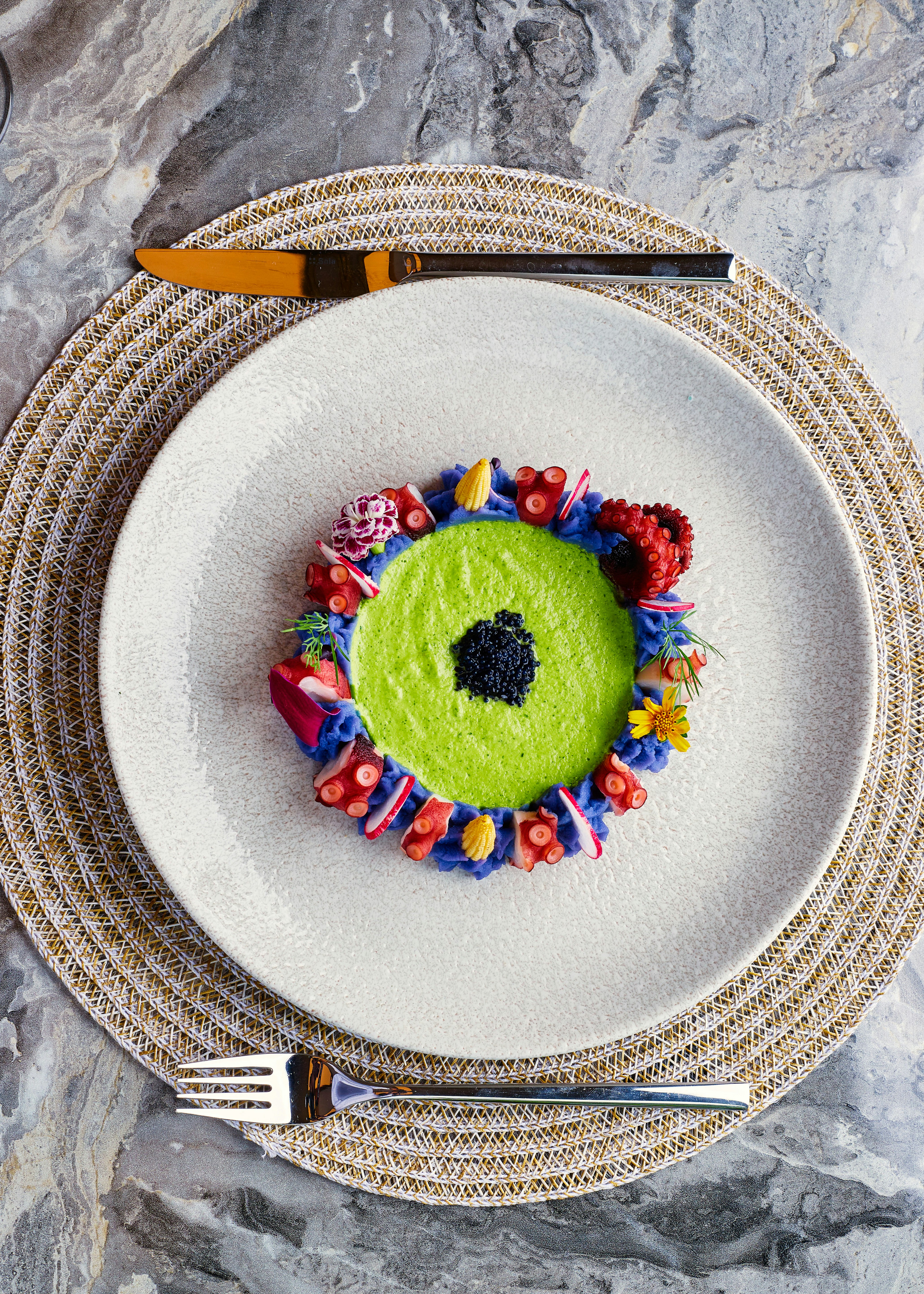 Gourmet dish with vibrant colors and seafood