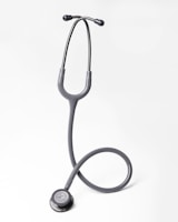 A gray stethoscope on a white background