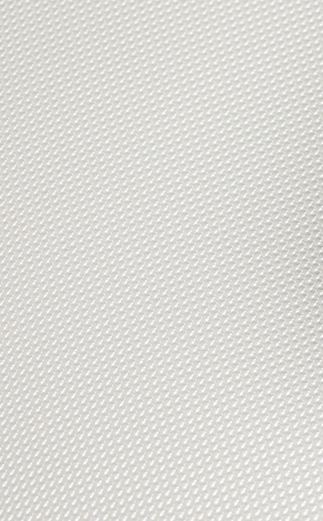 A white textured background with a subtle pattern