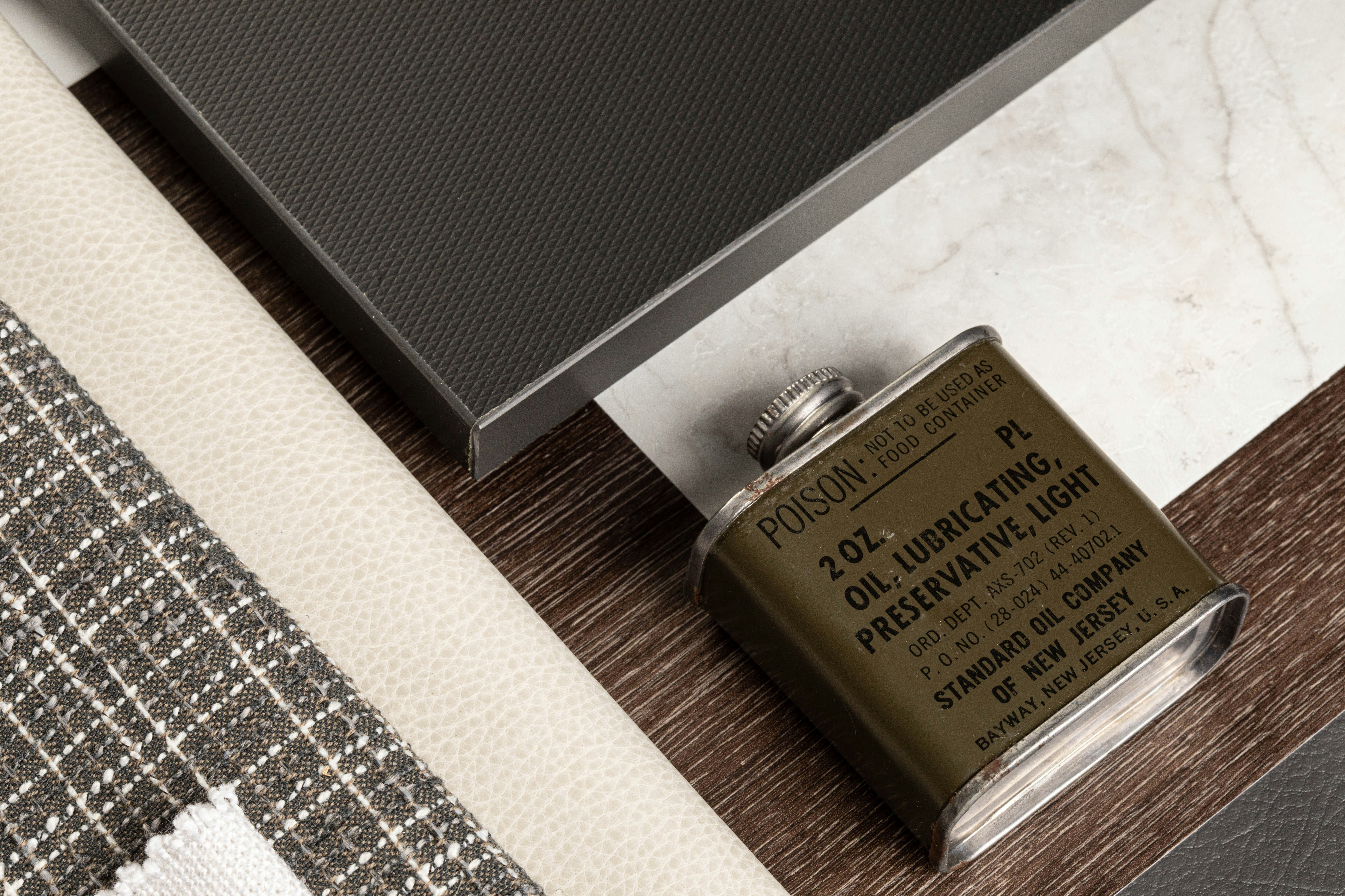 Small metal can of oil with label