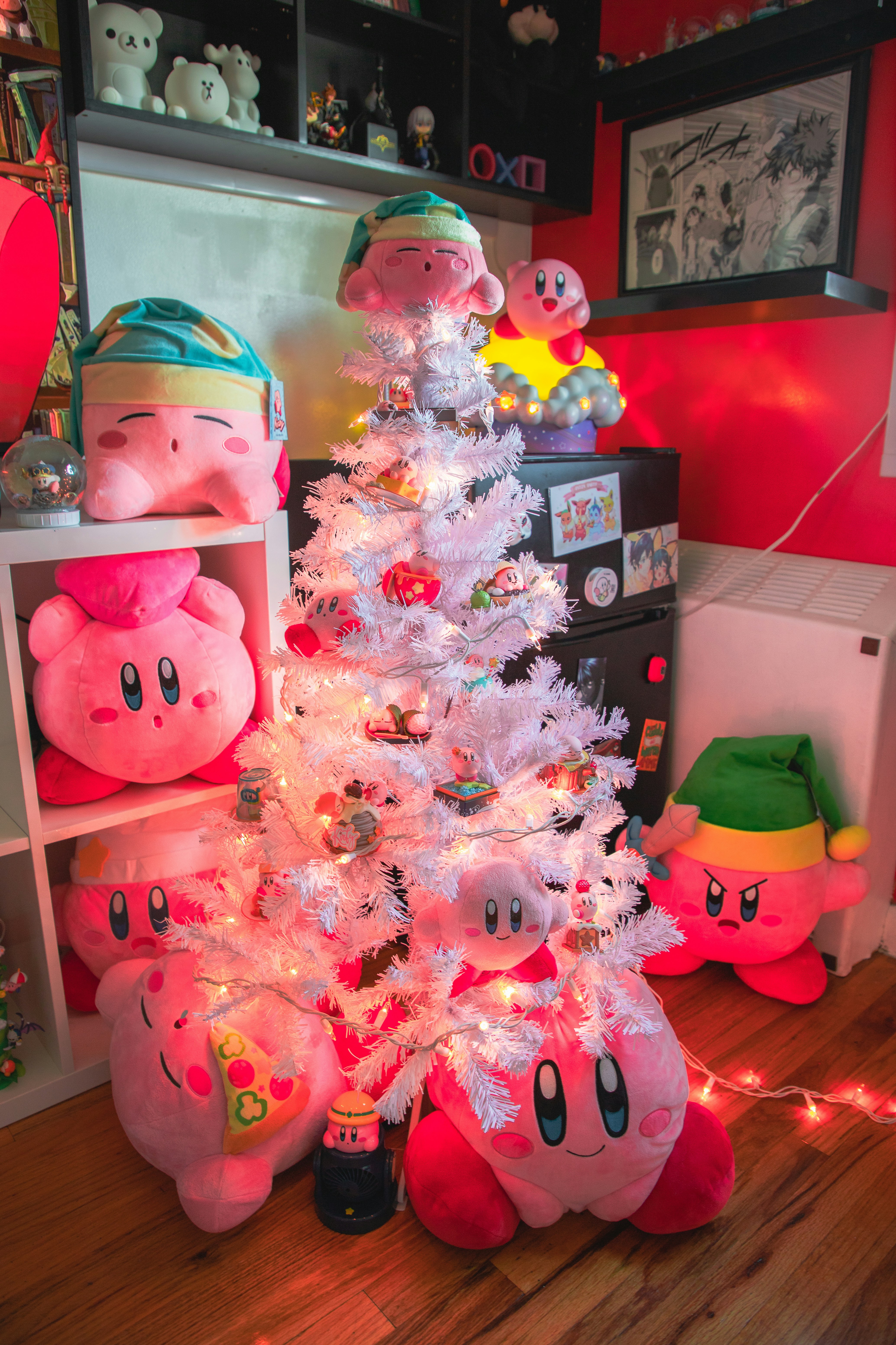 Kirby plush toys decorate a white christmas tree.