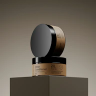 Two jars of deep conditioner stacked