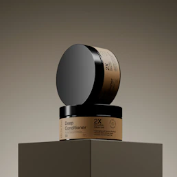 Two jars of deep conditioner stacked