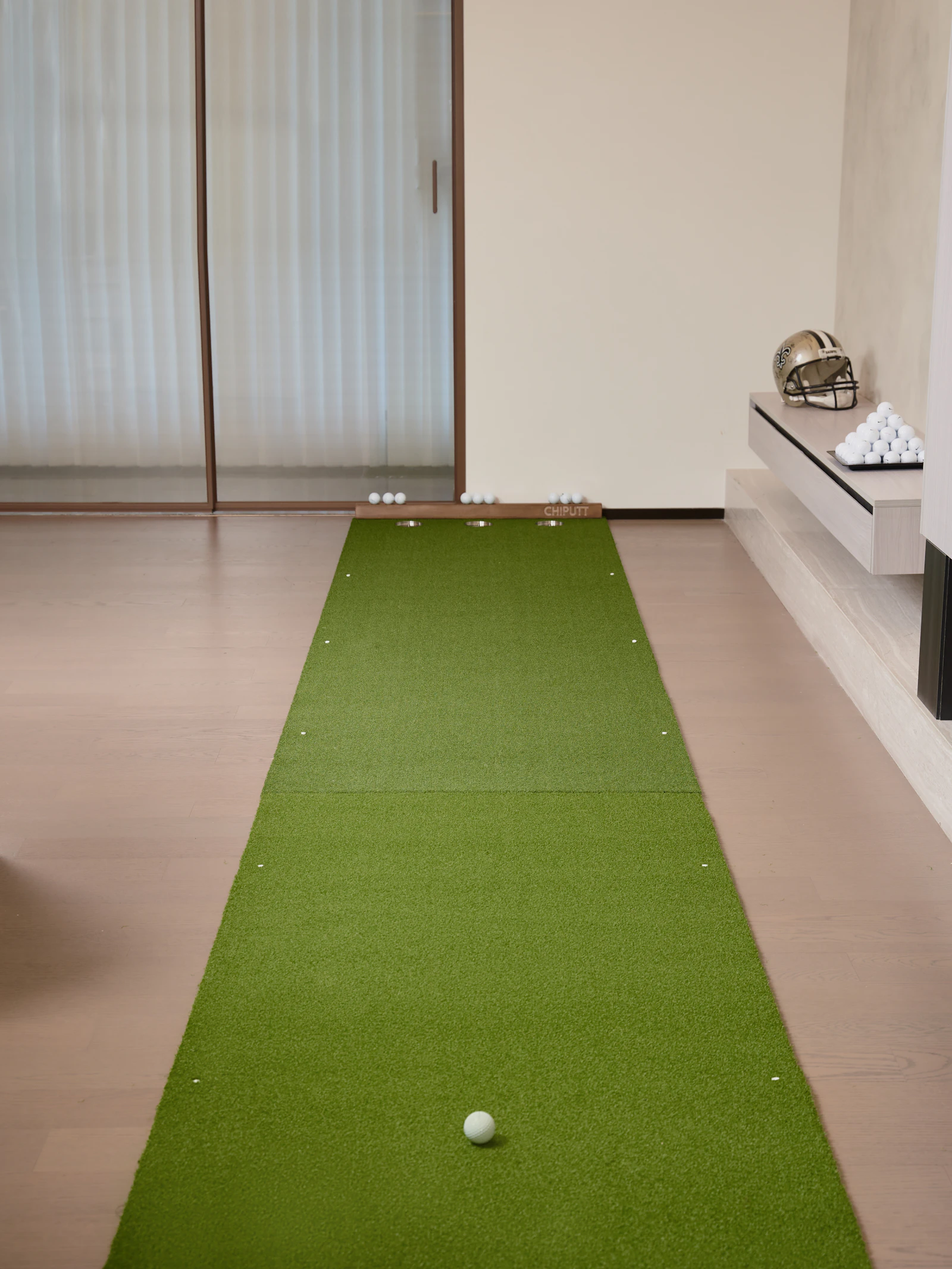 Indoor putting mat setup in a home golf practice space