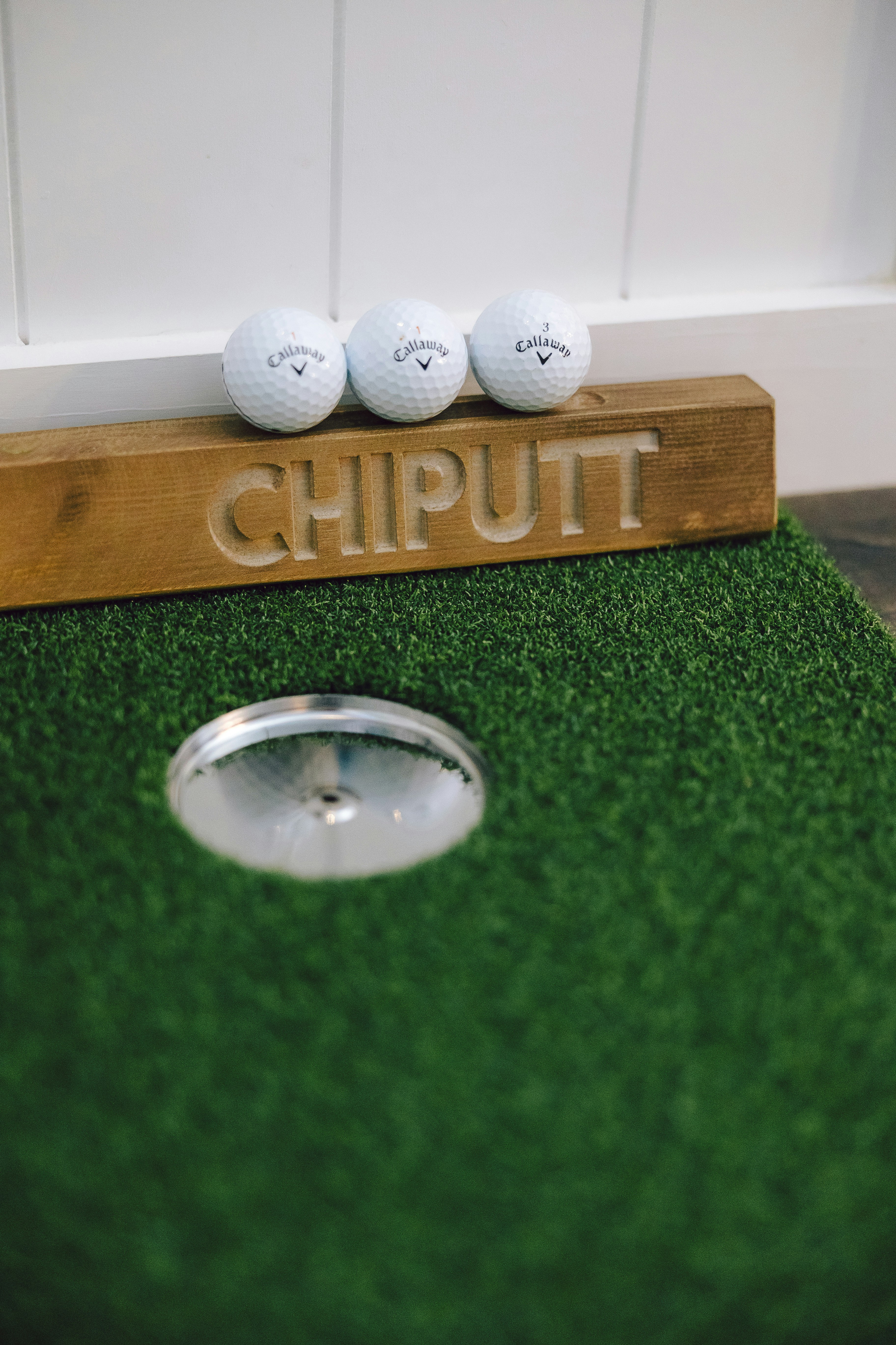Golf balls on an indoor putting green