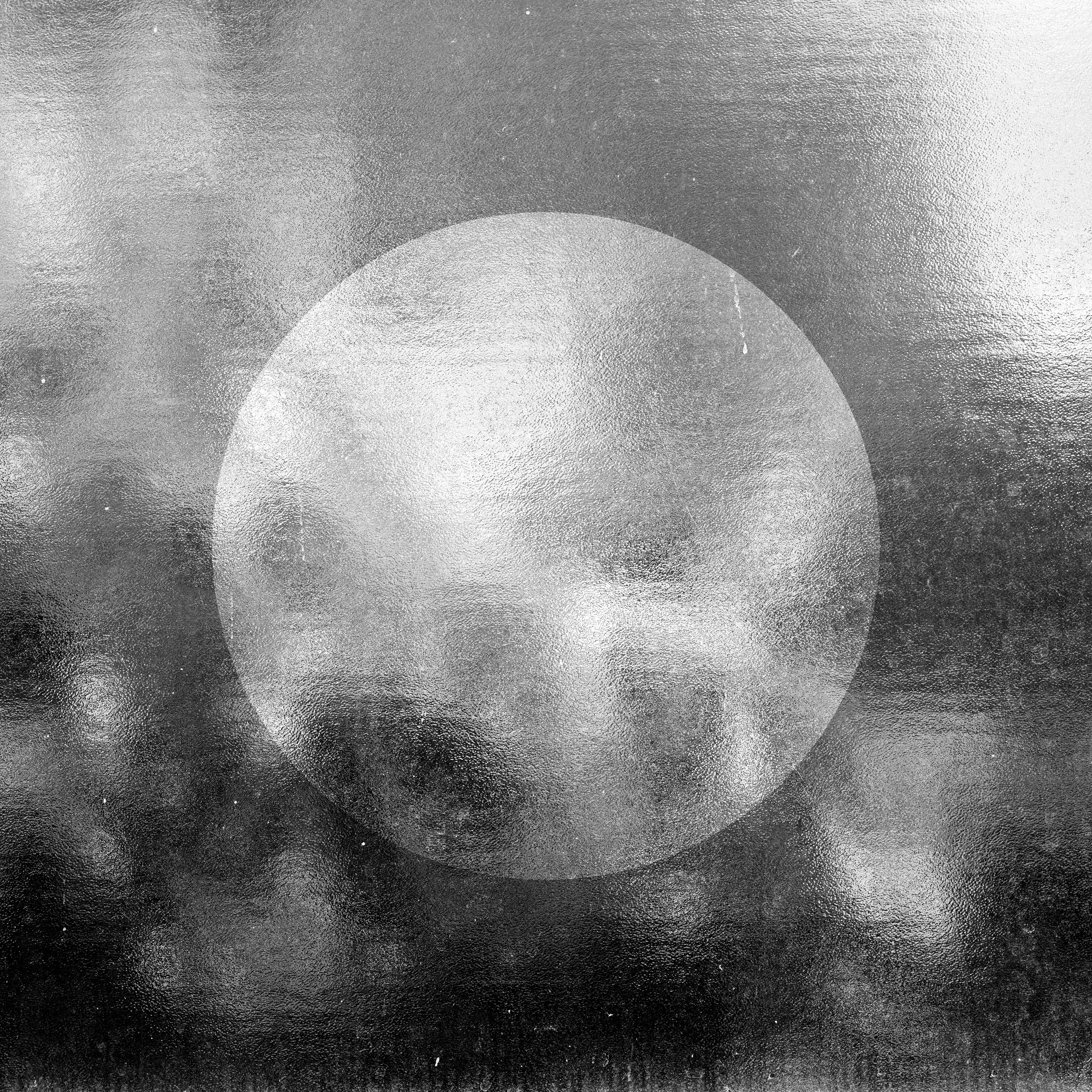 A faint circle on a textured background