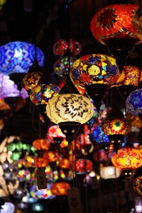 Colorful mosaic lamps hanging in the dark