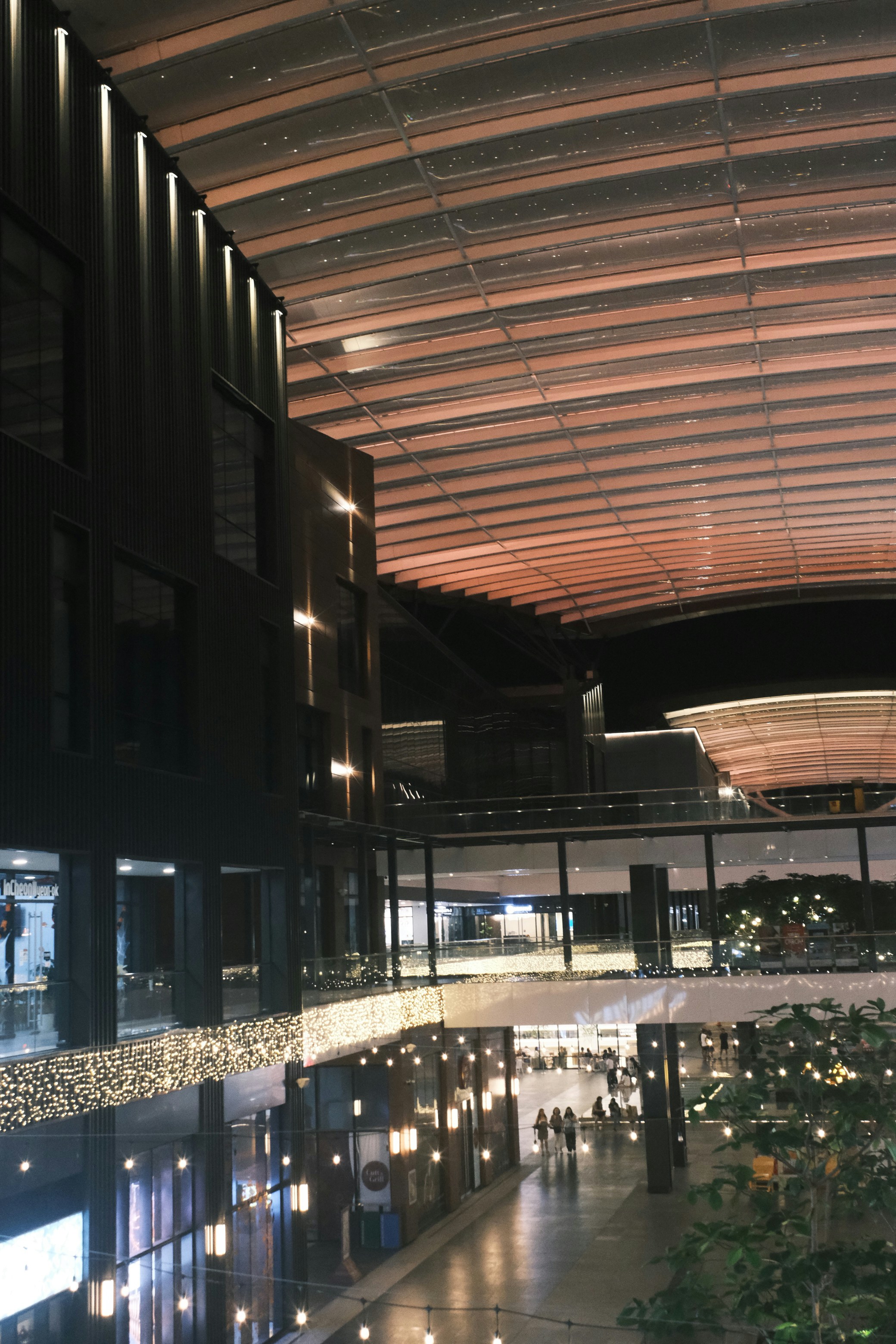 Modern interior of a shopping mall at dusk
