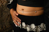 Woman wearing a belly chain with charms
