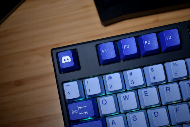 Close-up of a black keyboard with blue keys