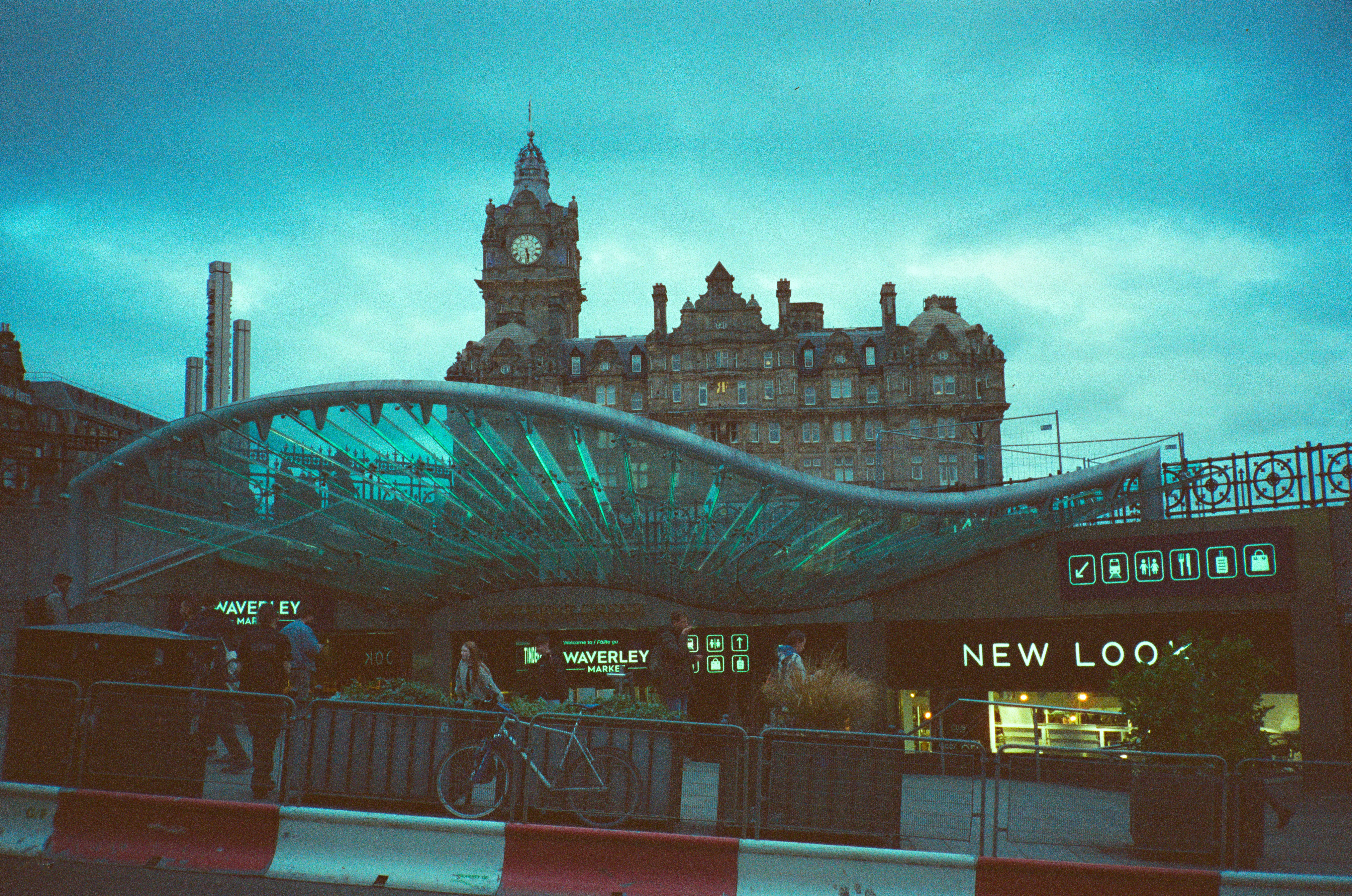 Modern bridge in front of historic building