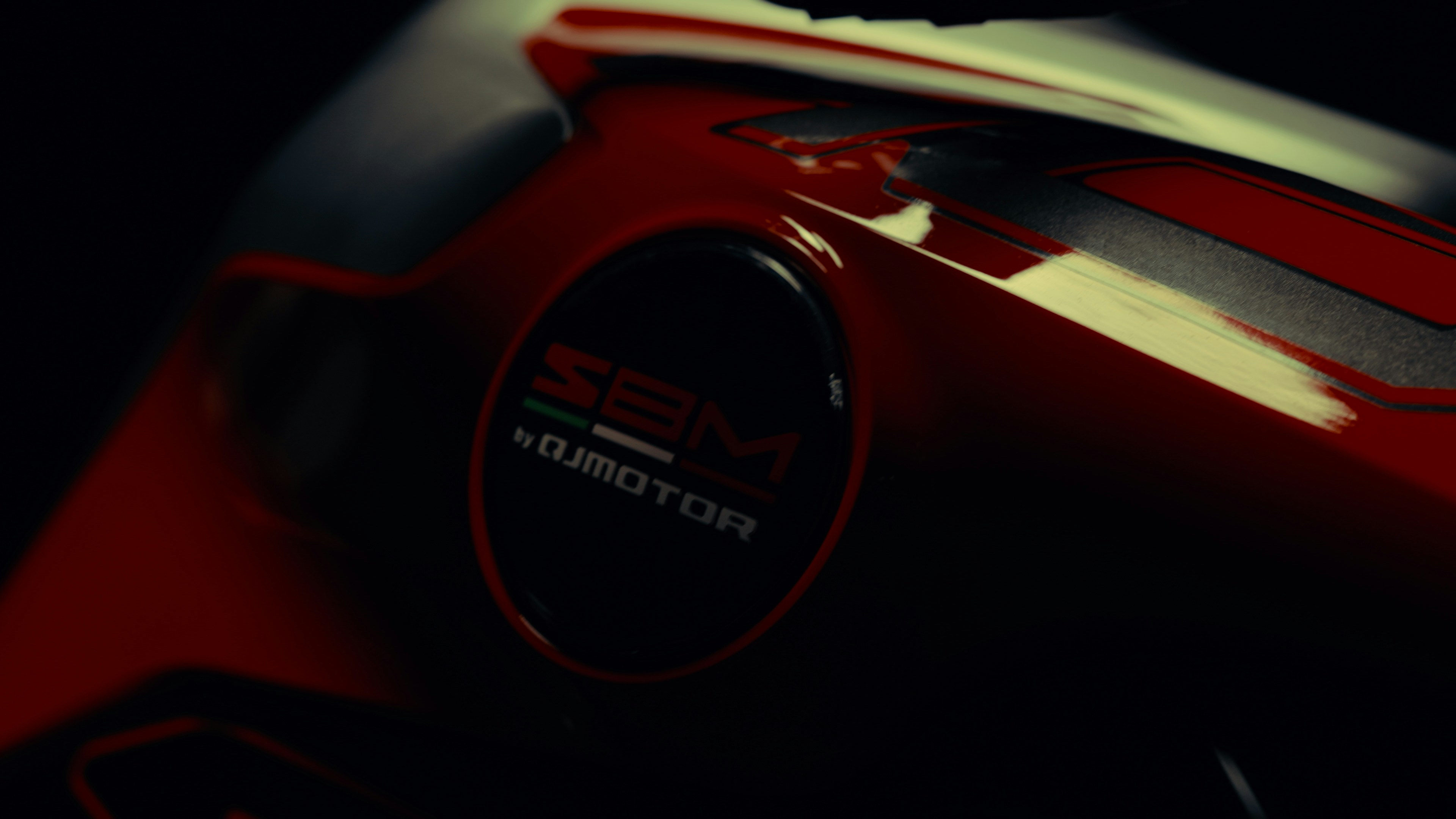 Close-up of a red motorcycle emblem