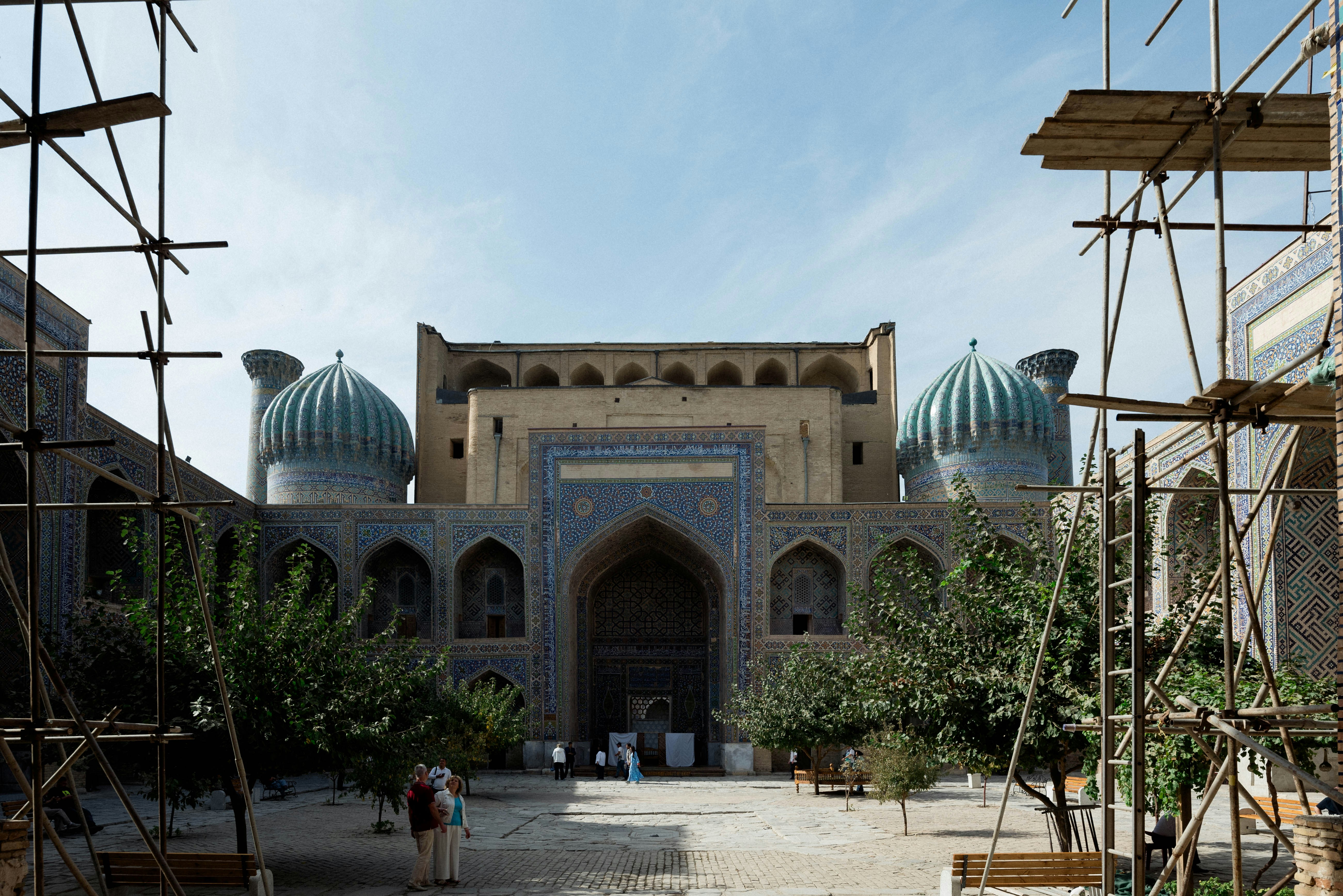 Courtyard of a mosque with scaffolding and domes