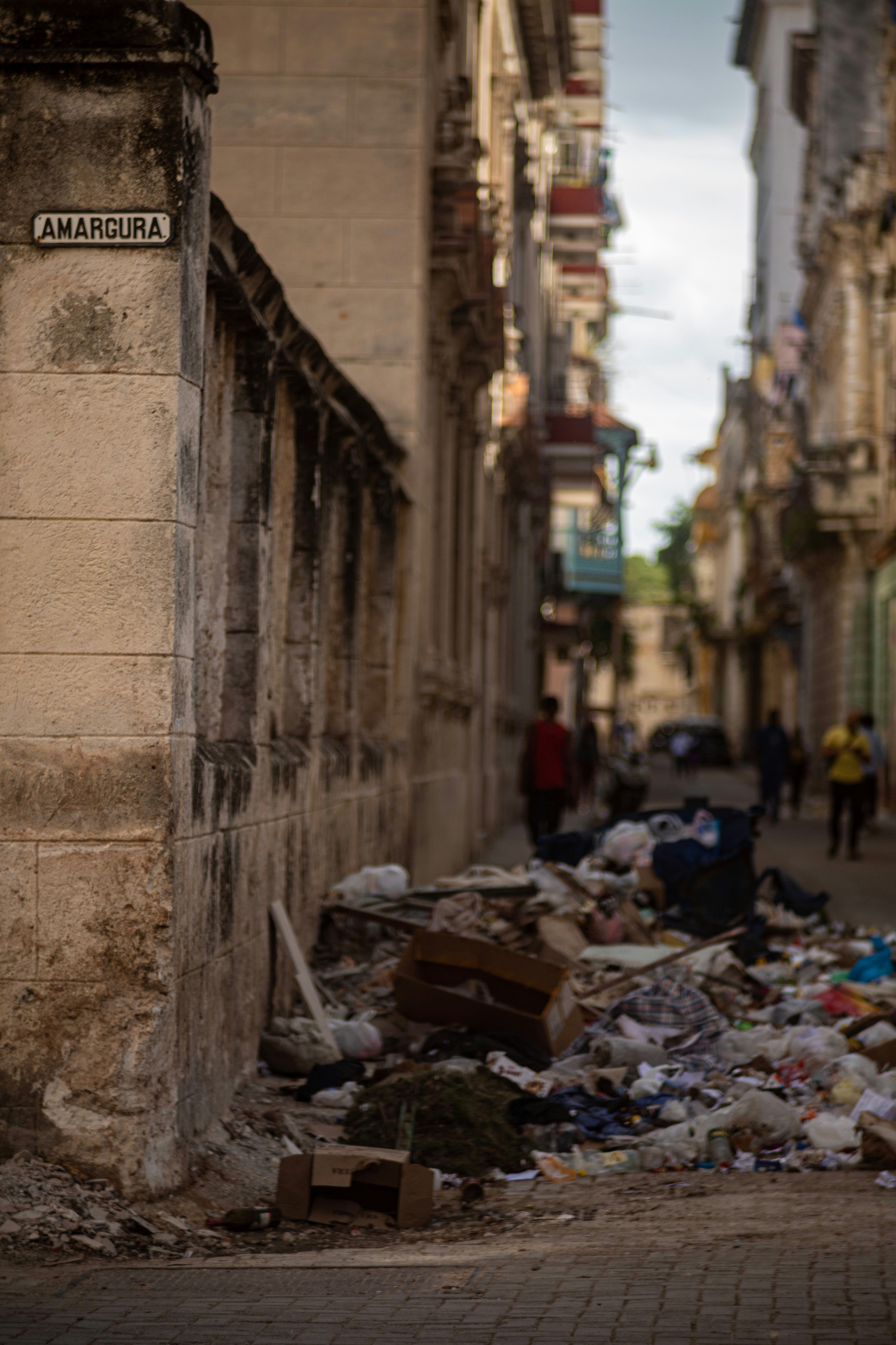 Street scene with piles of trash and buildings
