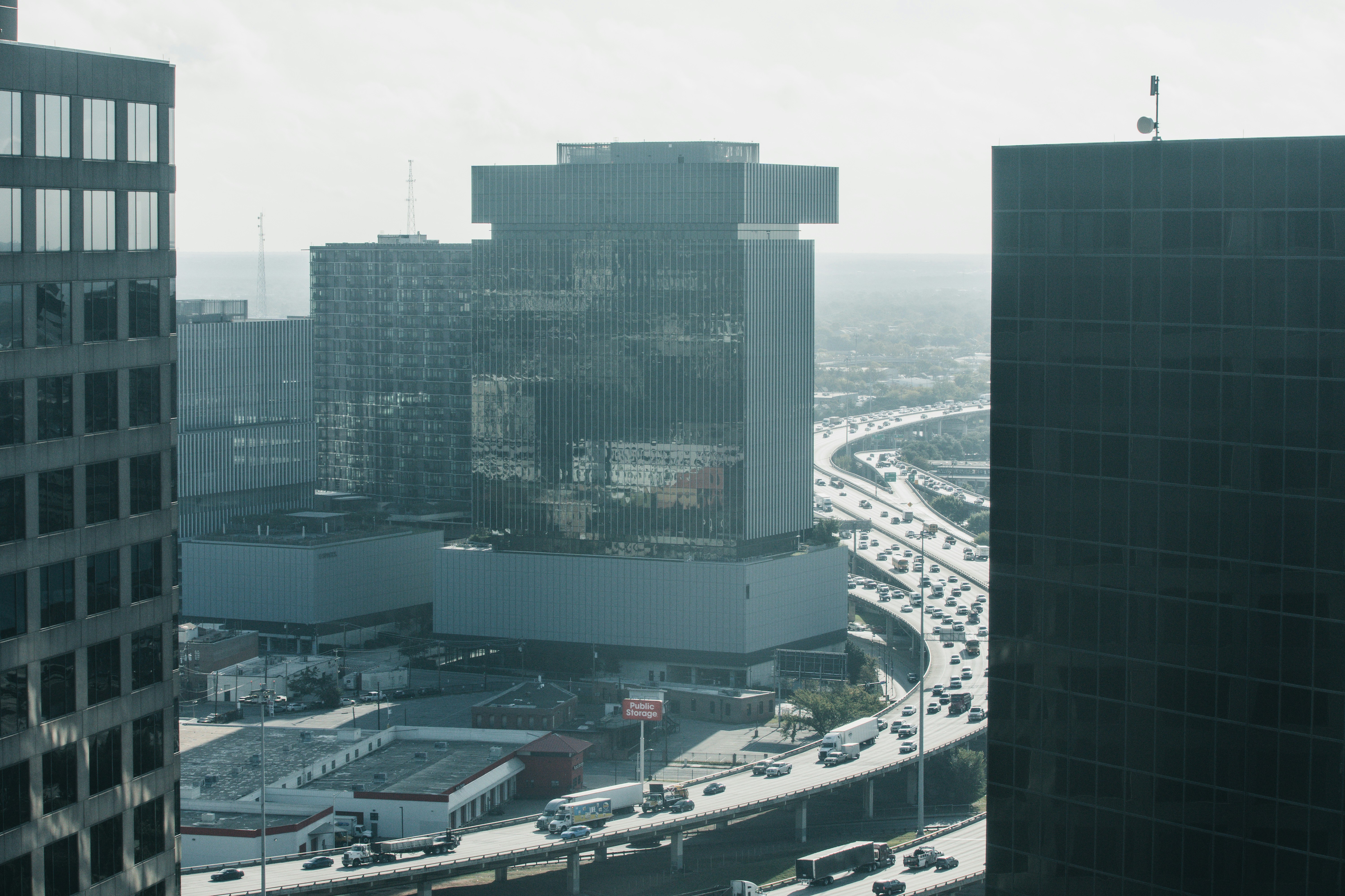 Modern skyscrapers and busy highway traffic in a city