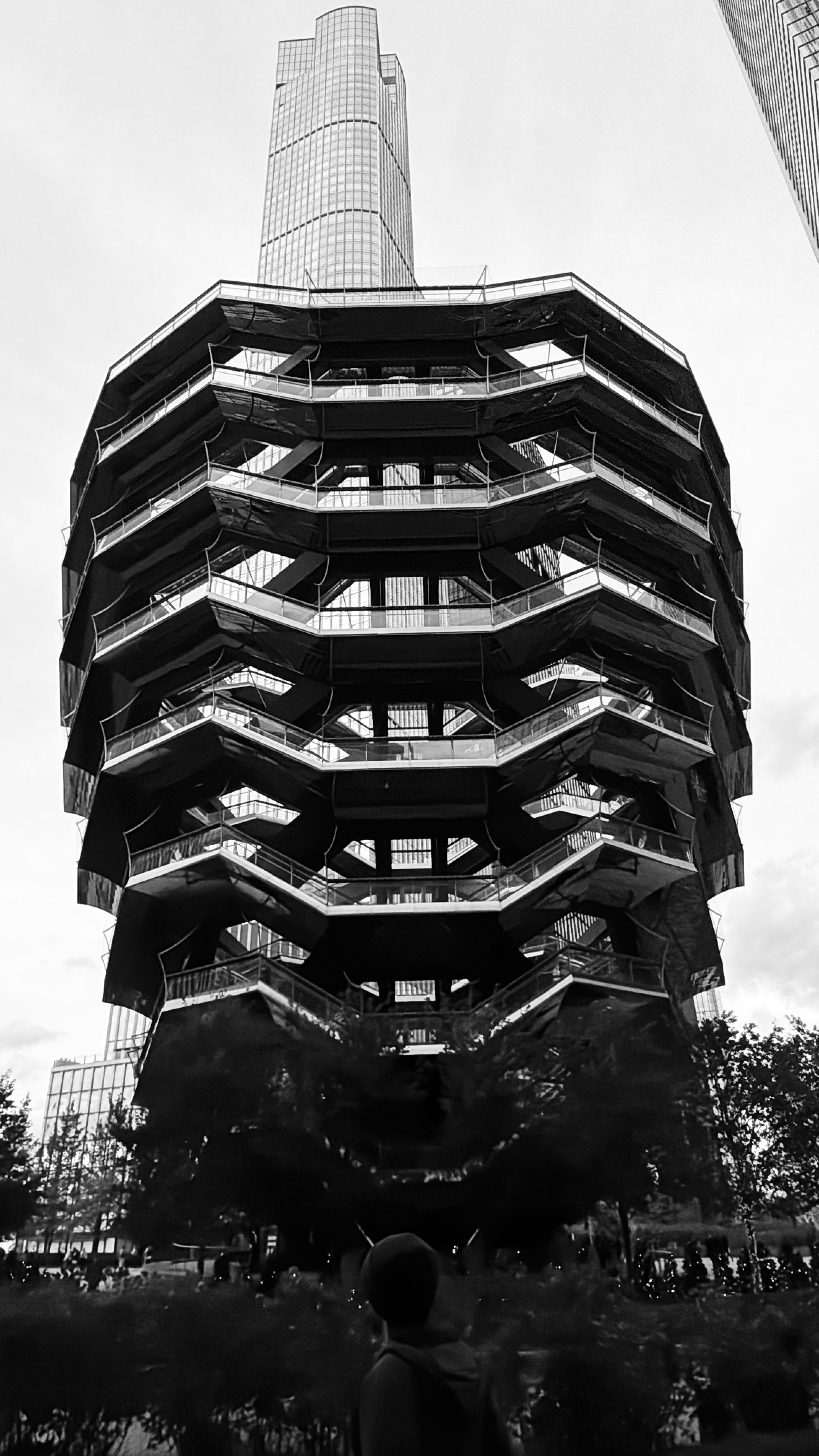 Modern architecture with a person looking up.