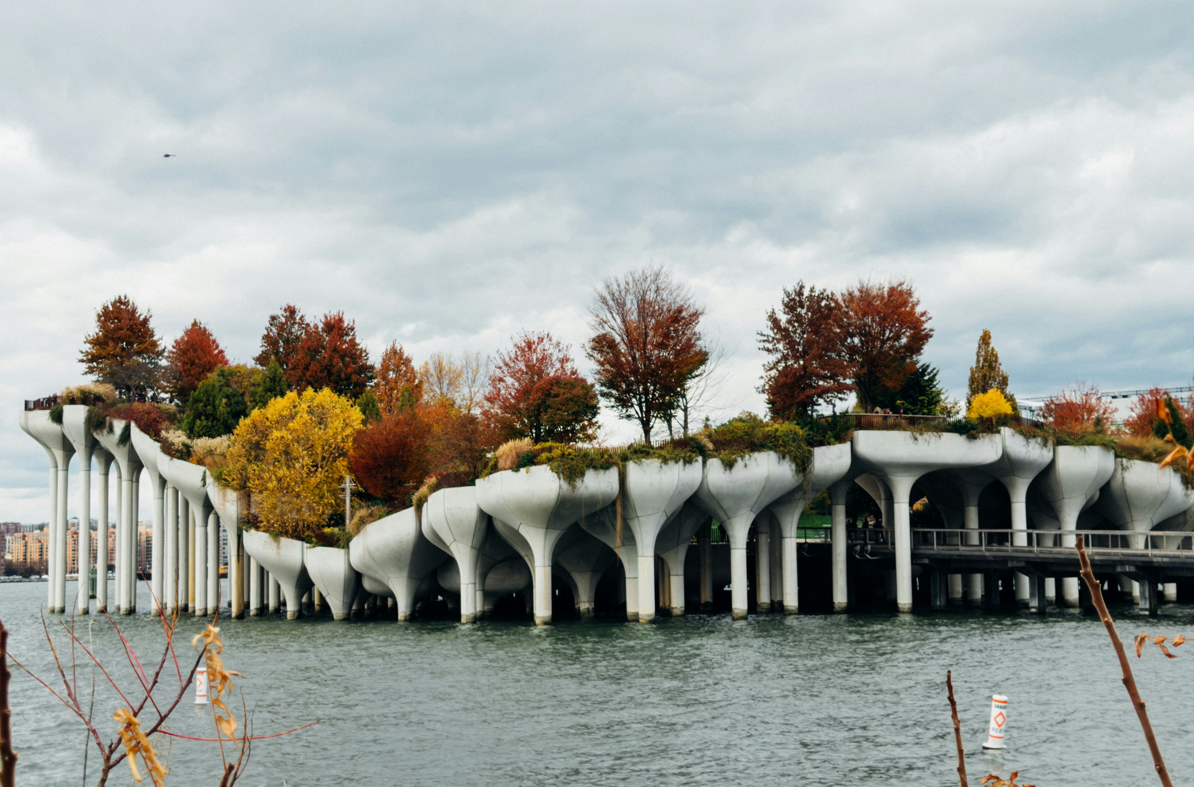 Modern island park with colorful autumn trees