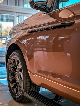 Brown car with black trim and wheels