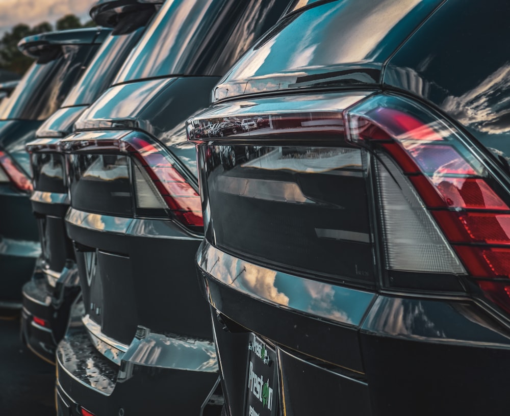 Row of cars parked at a dealer lot
