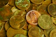 Pile of lincoln pennies with one prominent