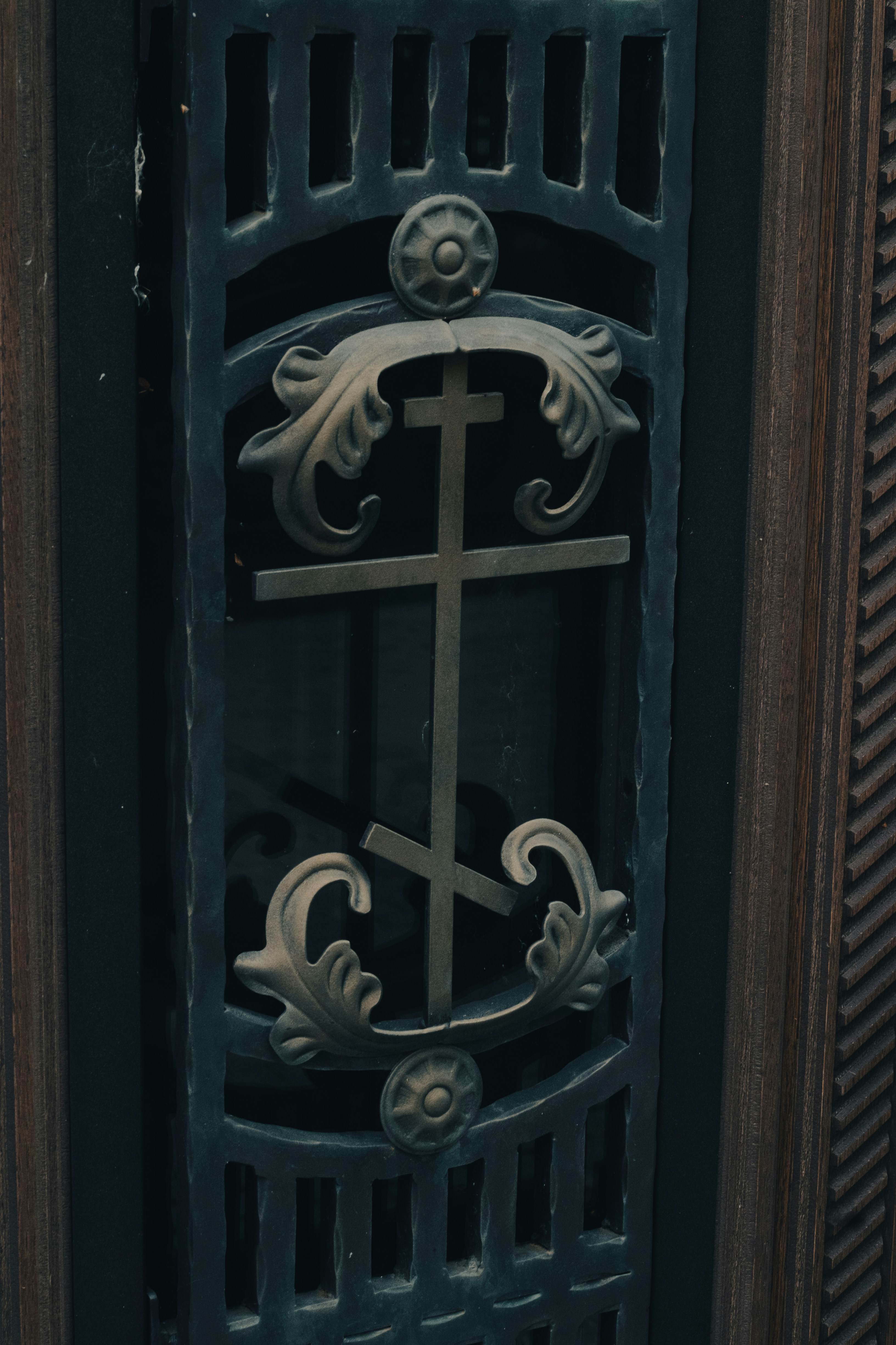 Ornate metal gate with orthodox christian cross