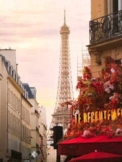Eiffel tower seen from a parisian street with cafe.