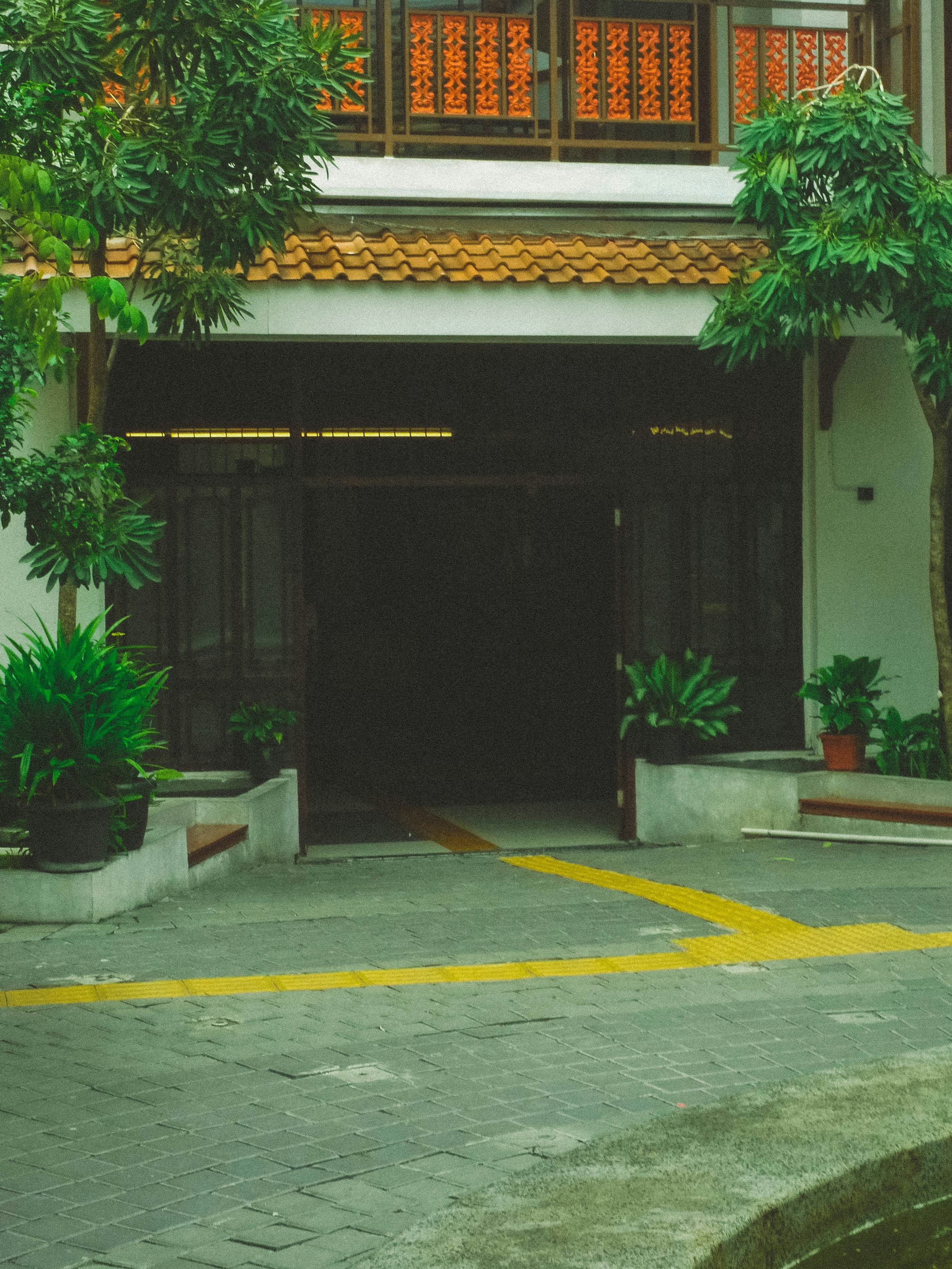 Entrance to a building with trees and plants