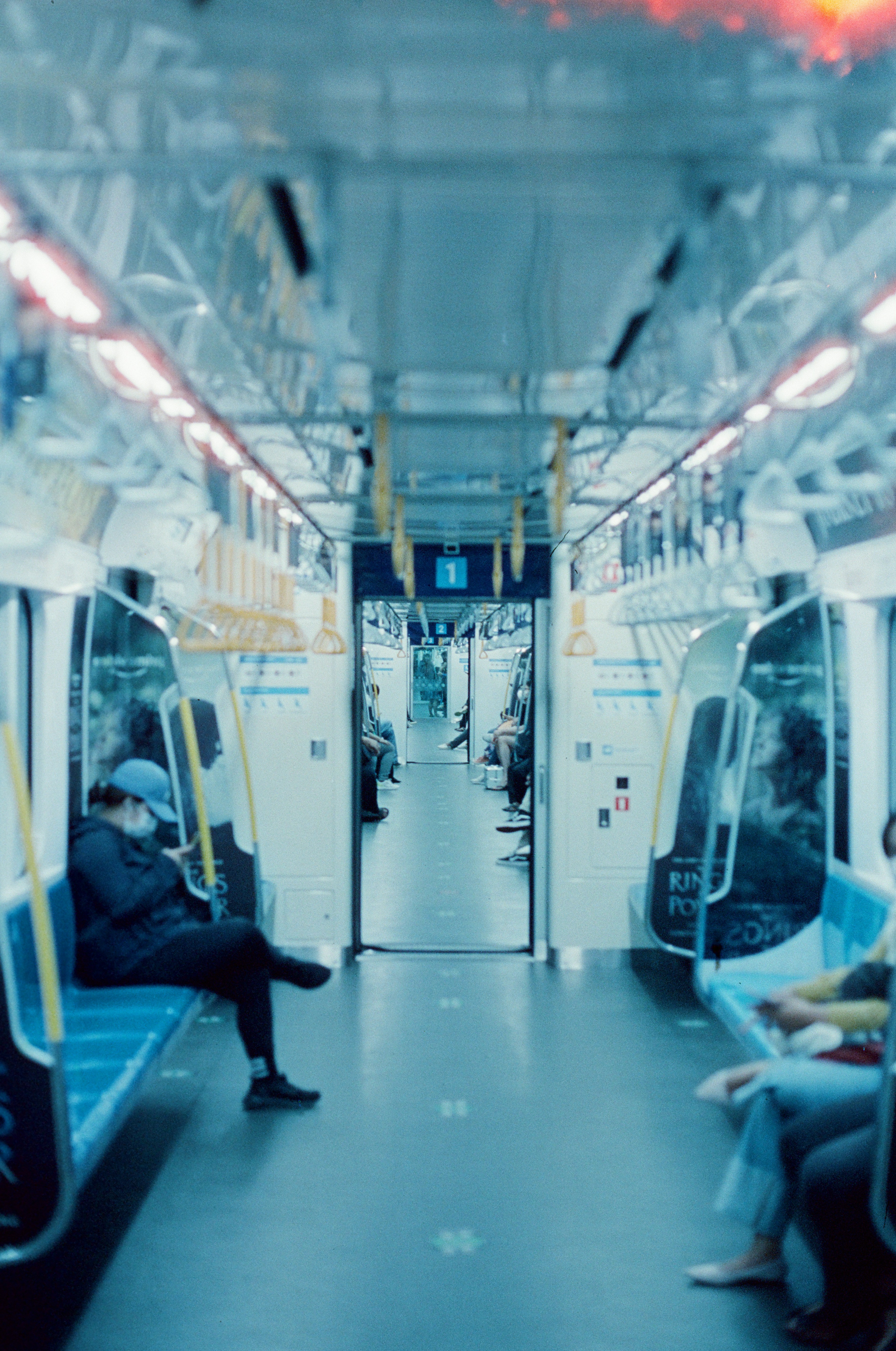 People sitting inside a modern train carriage
