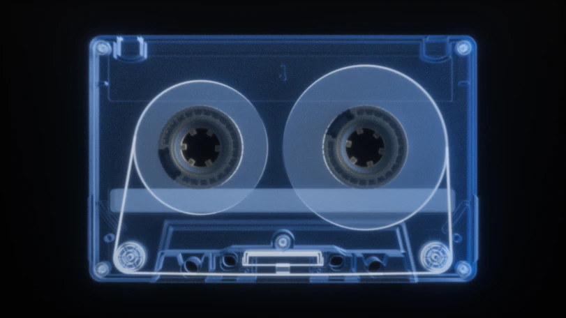 X-ray of a vintage cassette tape on black background