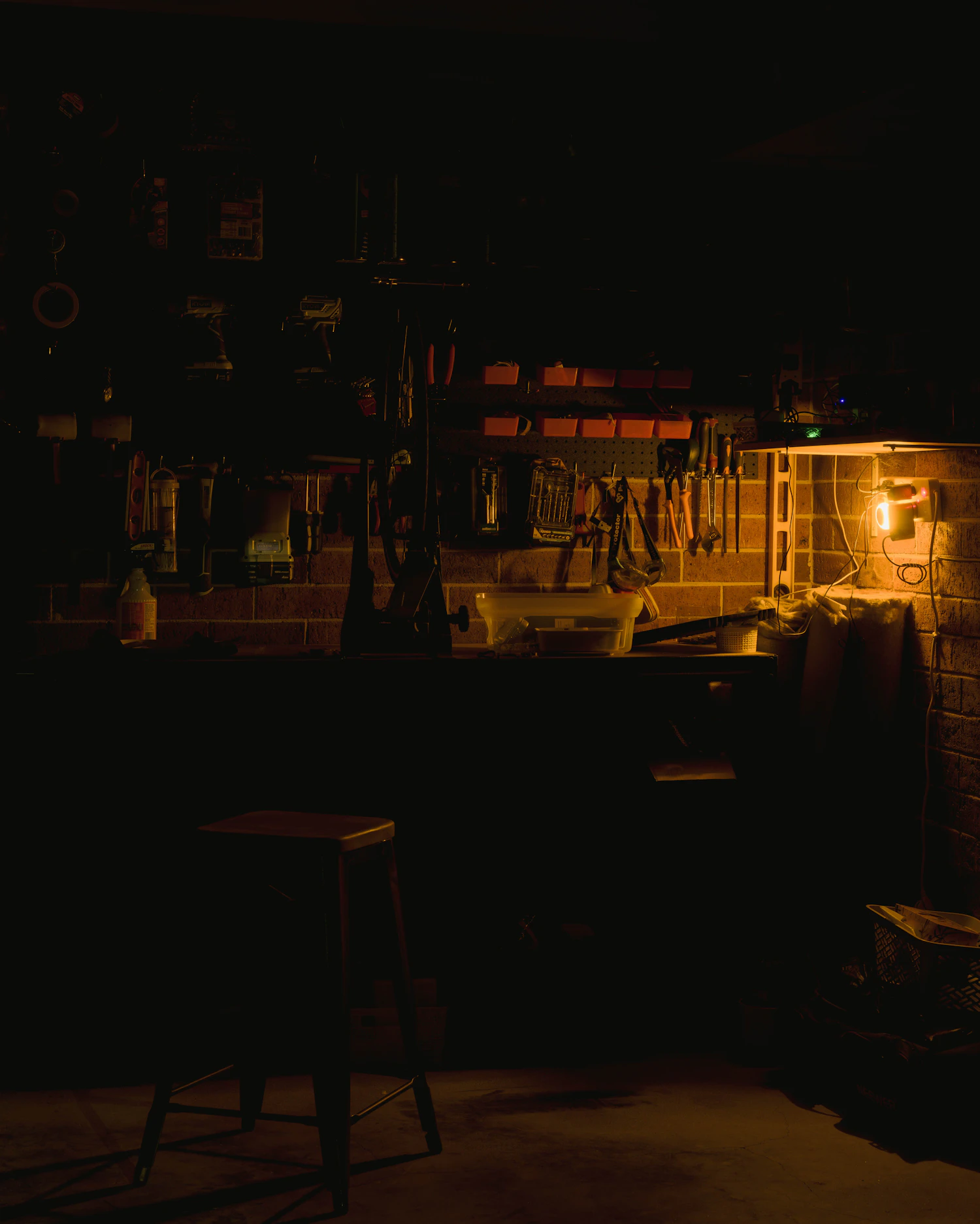 The Werklicht bench hall at night, lit by one source off the left-hand wall