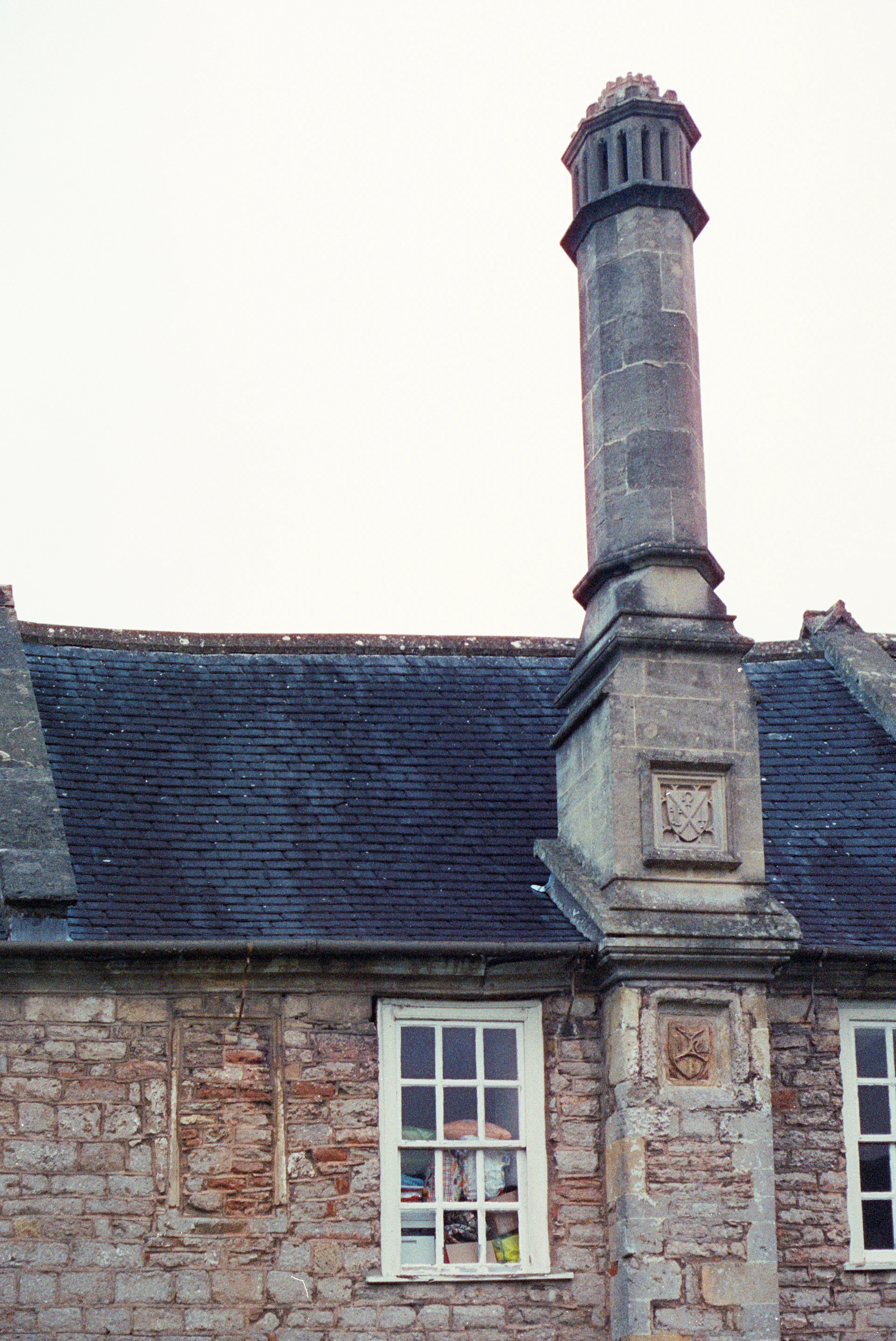 Stone building with ornate chimney and window