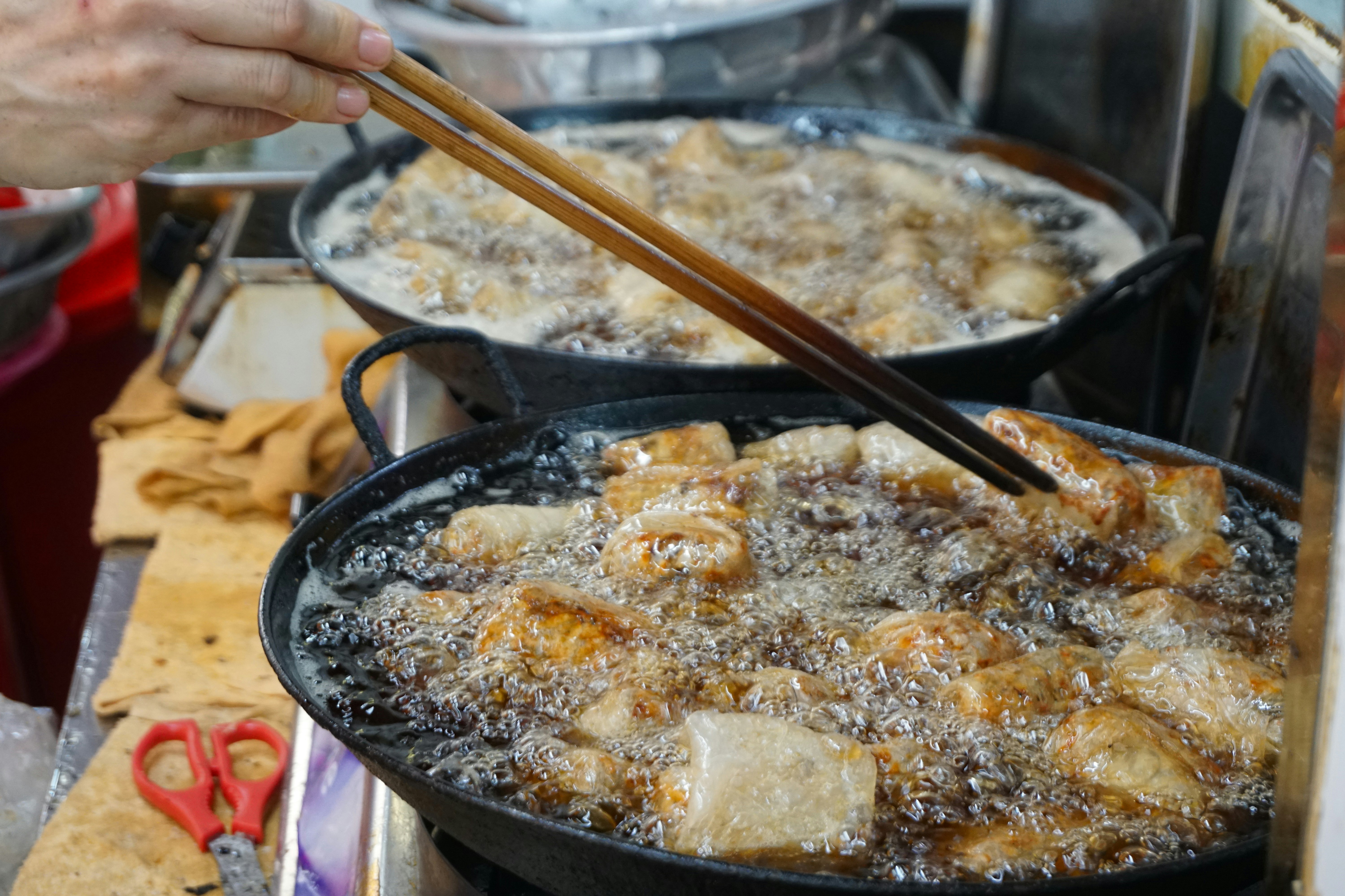 Food being fried in bubbling oil