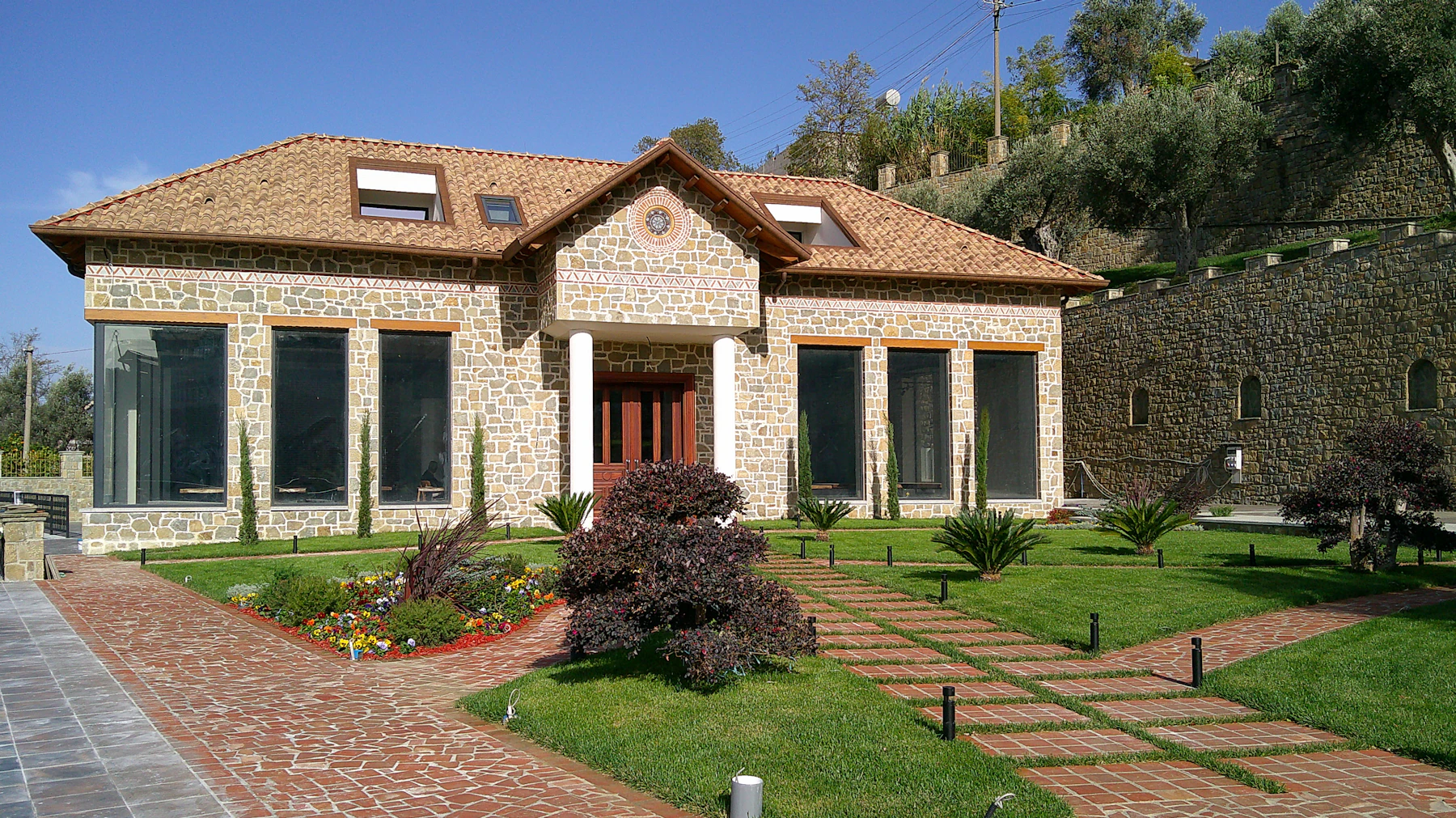 Landscaped lawn and planted approach