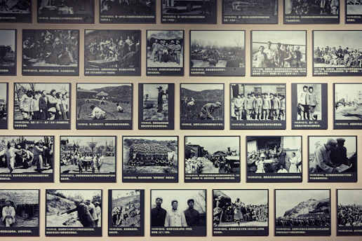 Wall display of historical black and white photographs