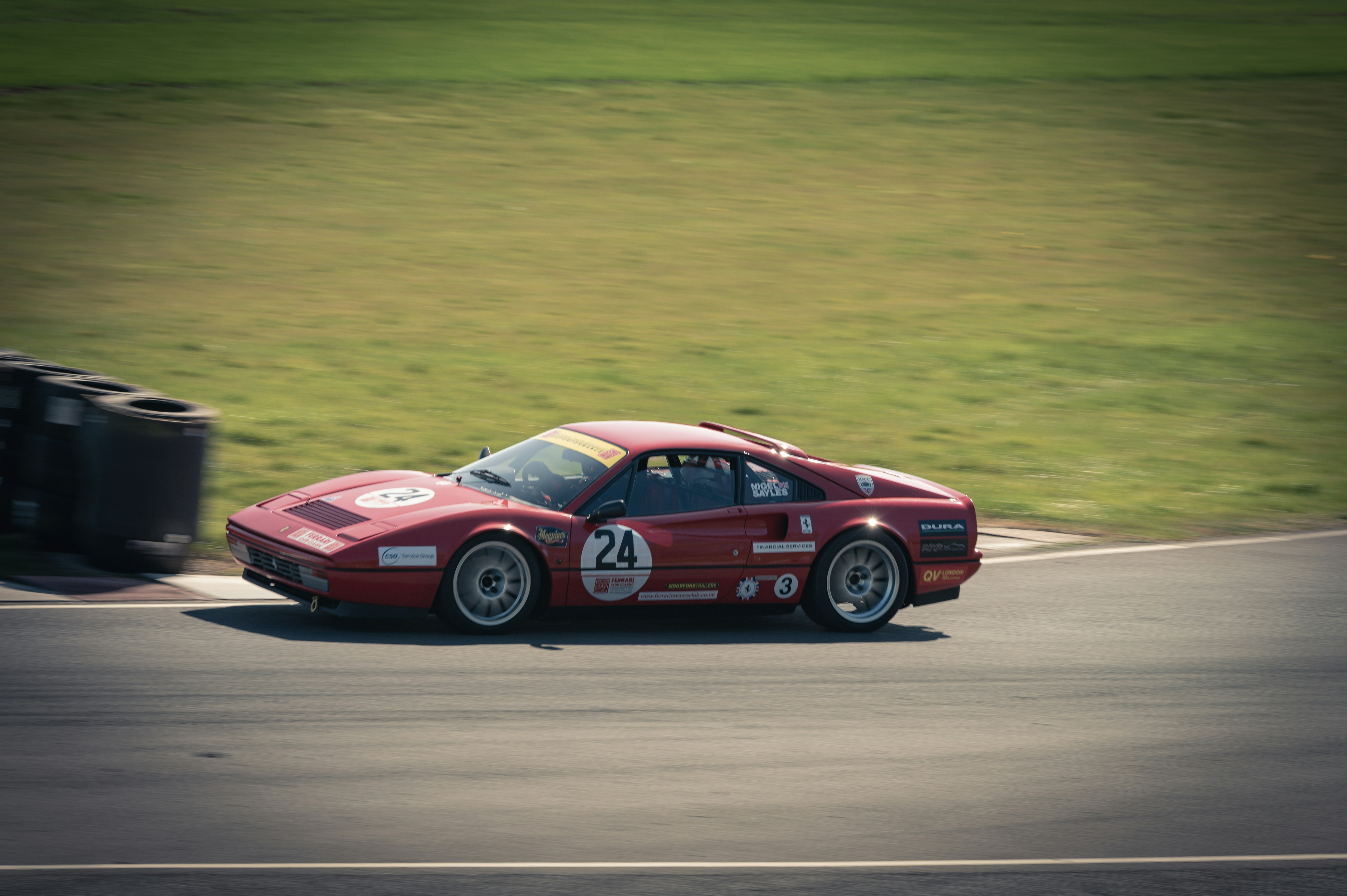 Red race car with number 24 on track