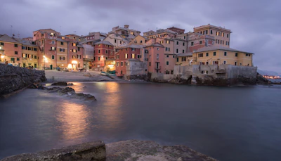The pastel houses of Boccadasse, the fishing cove inside Genoa, at dusk