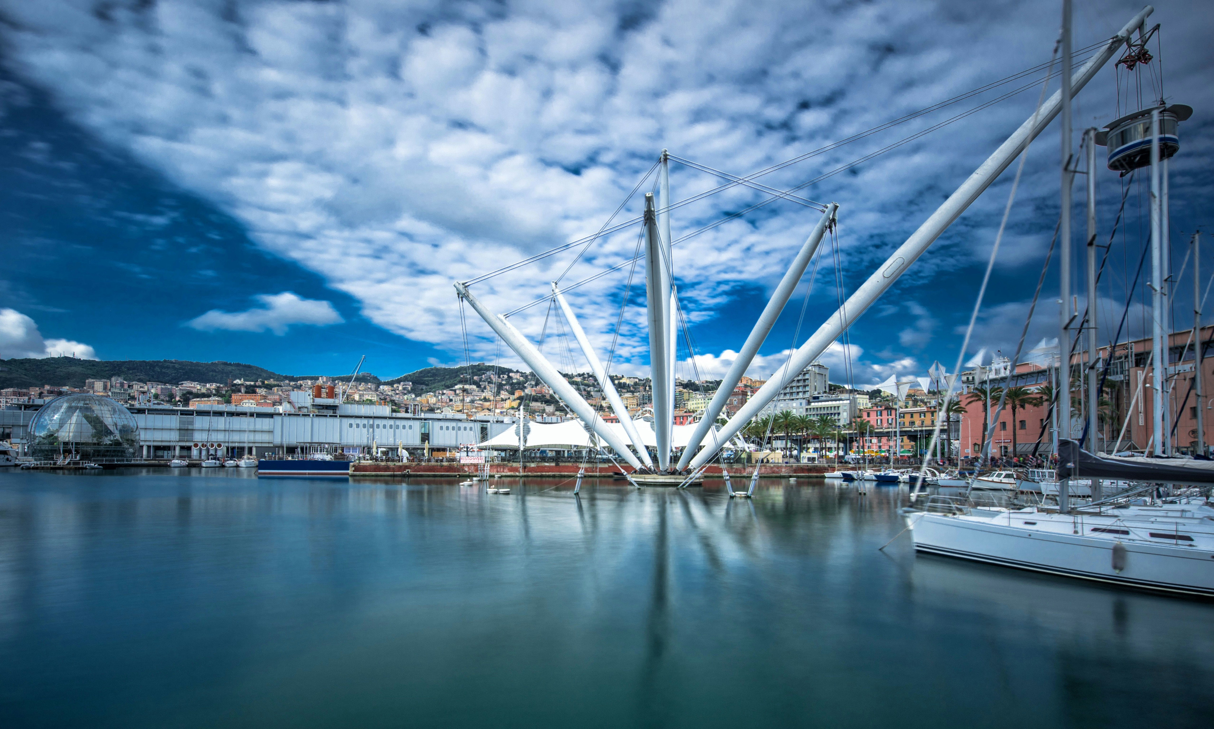 Modern waterfront architecture with boats in the harbor.