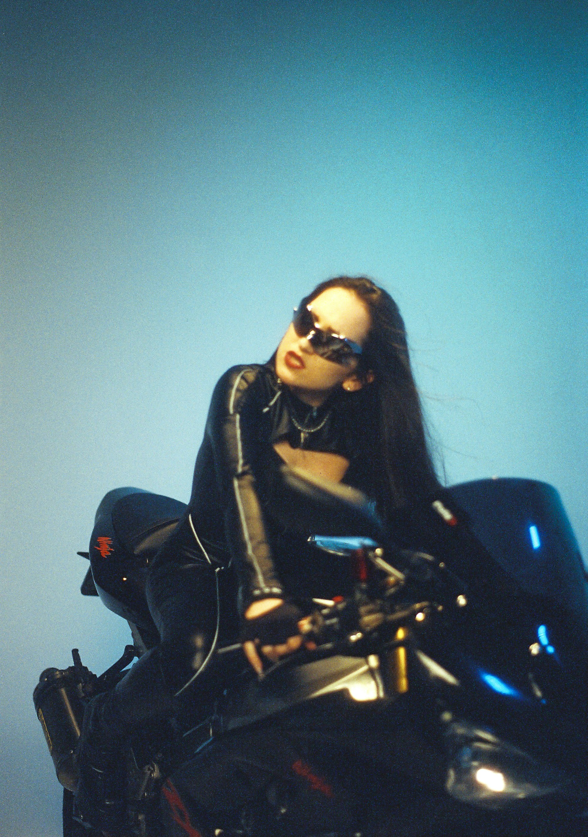 Woman in leather riding a motorcycle