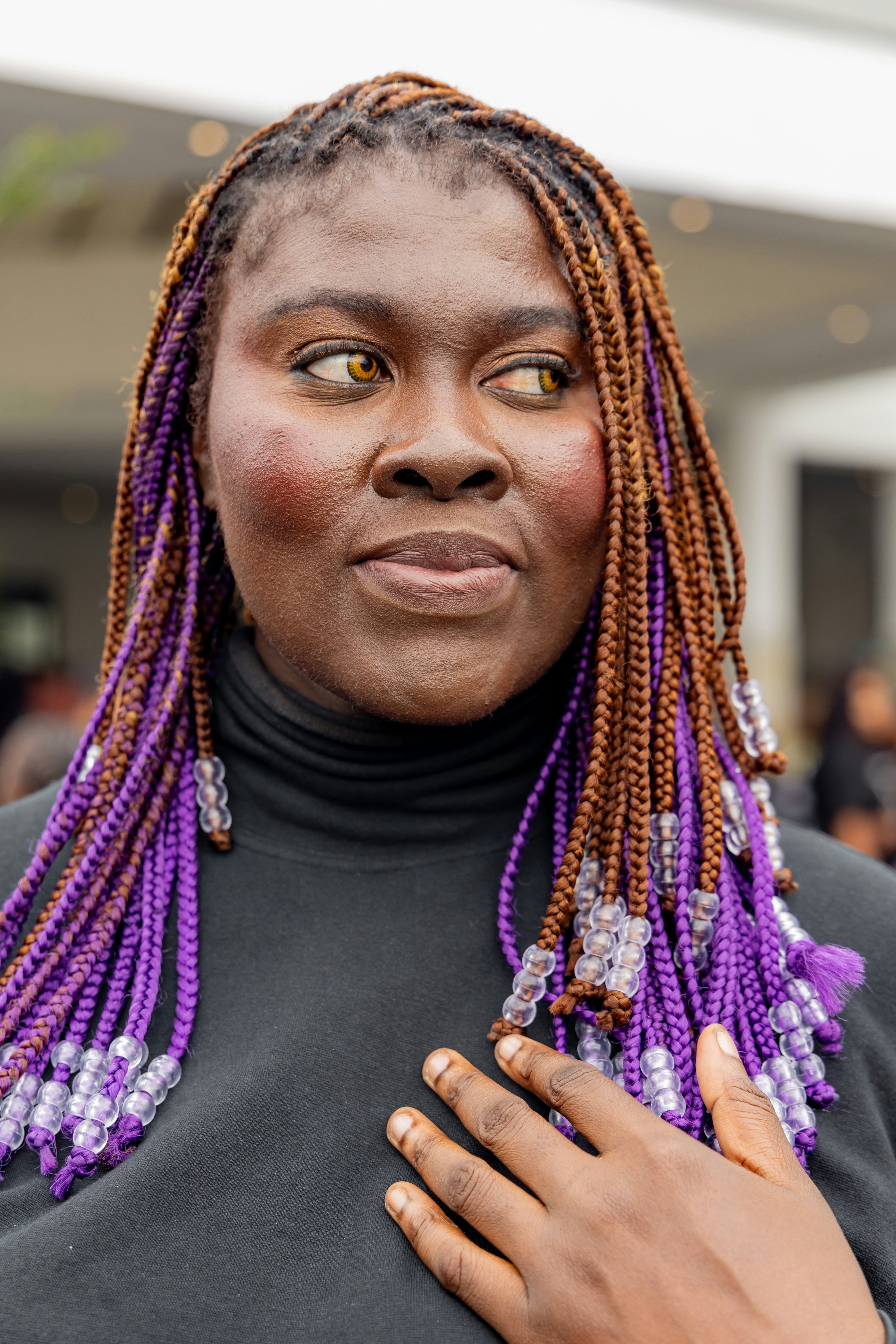 Woman with braided hair and beads