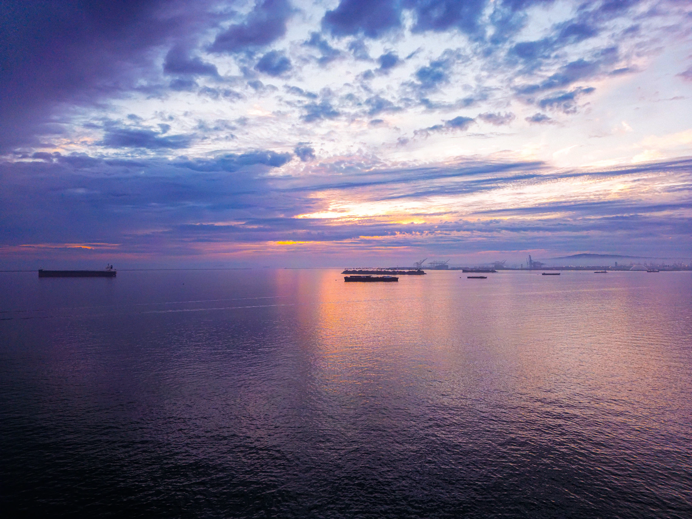 Container vessel at ocean sunset