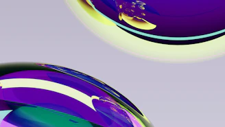 Abstract purple and yellow swirls on spheres.