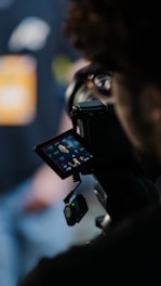 Filming setup with a person operating a video camera.