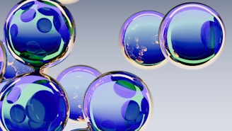Abstract blue spheres with reflections on gray background.