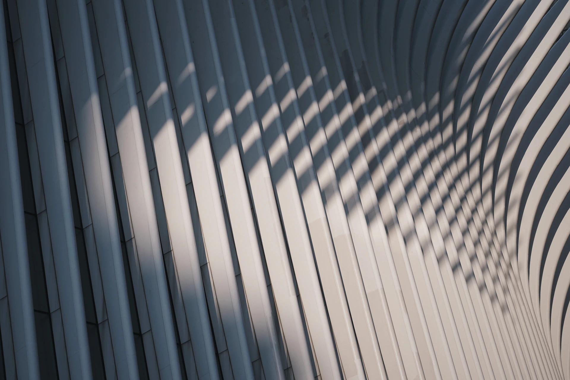 Modern architectural facade with striped shadow patterns